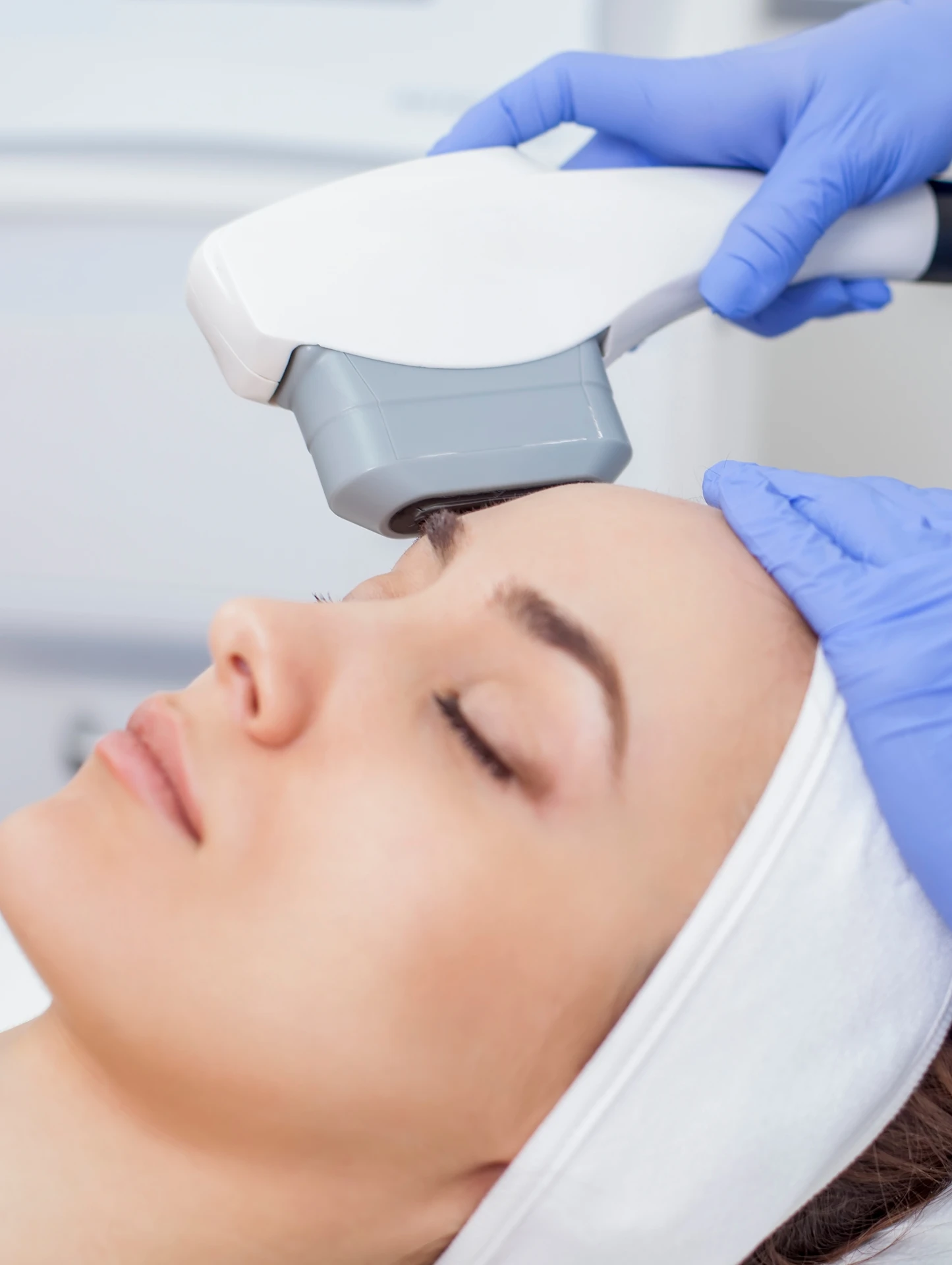 woman having treatment on her head