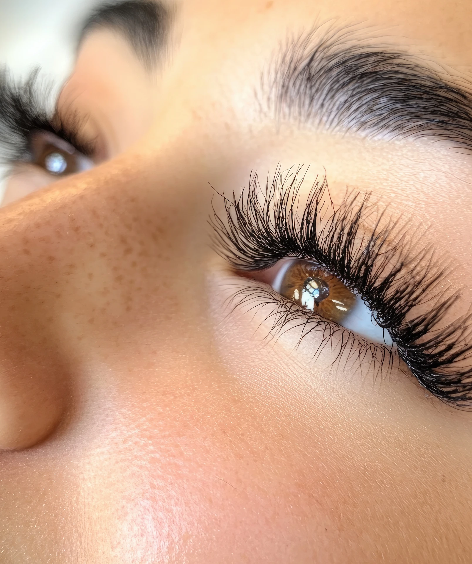 close up of a woman's brown eye