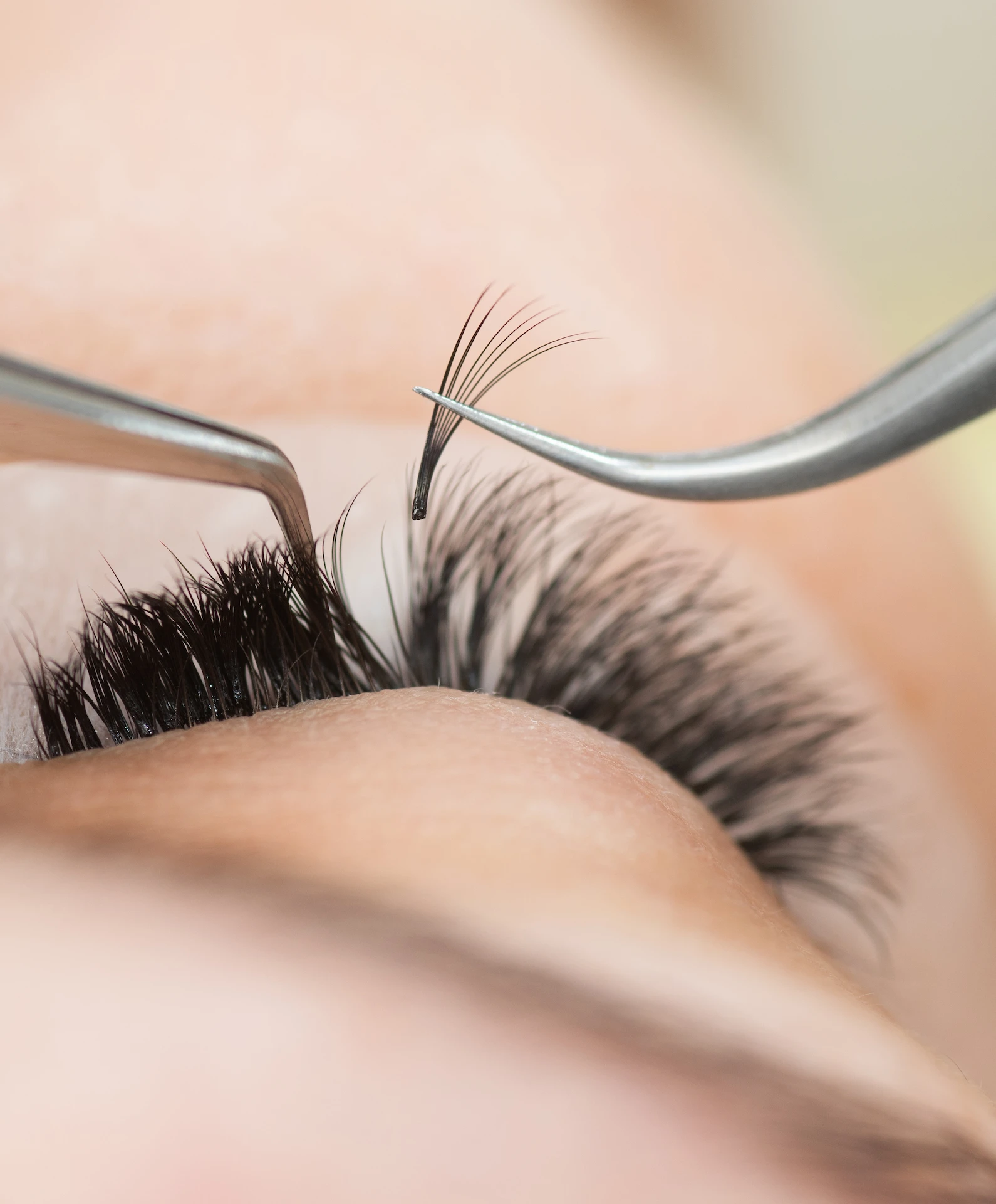 close up of an eye lash being removed