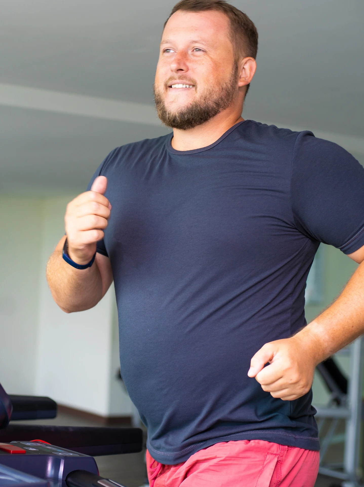 man running on a machine