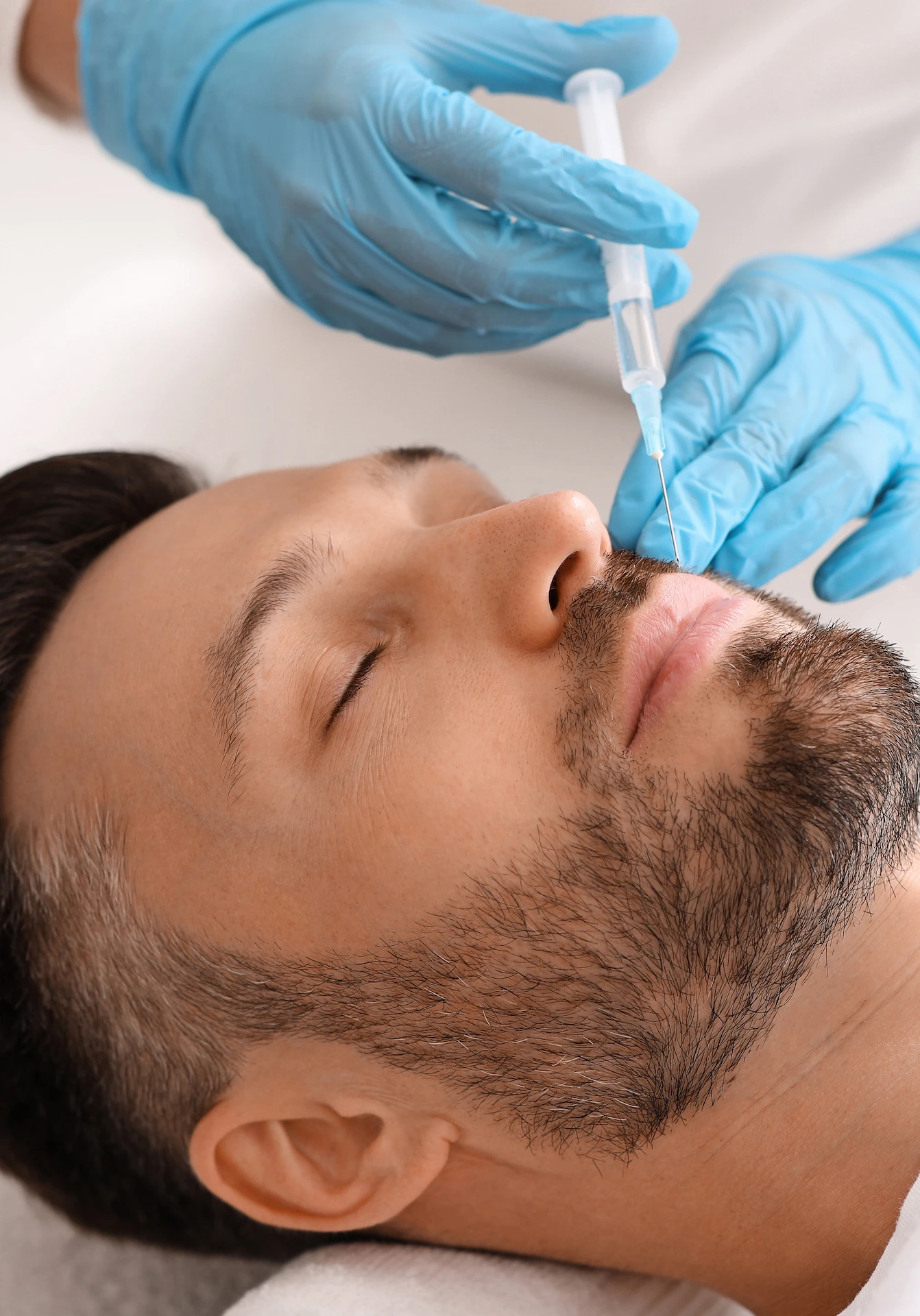 mans face being injected