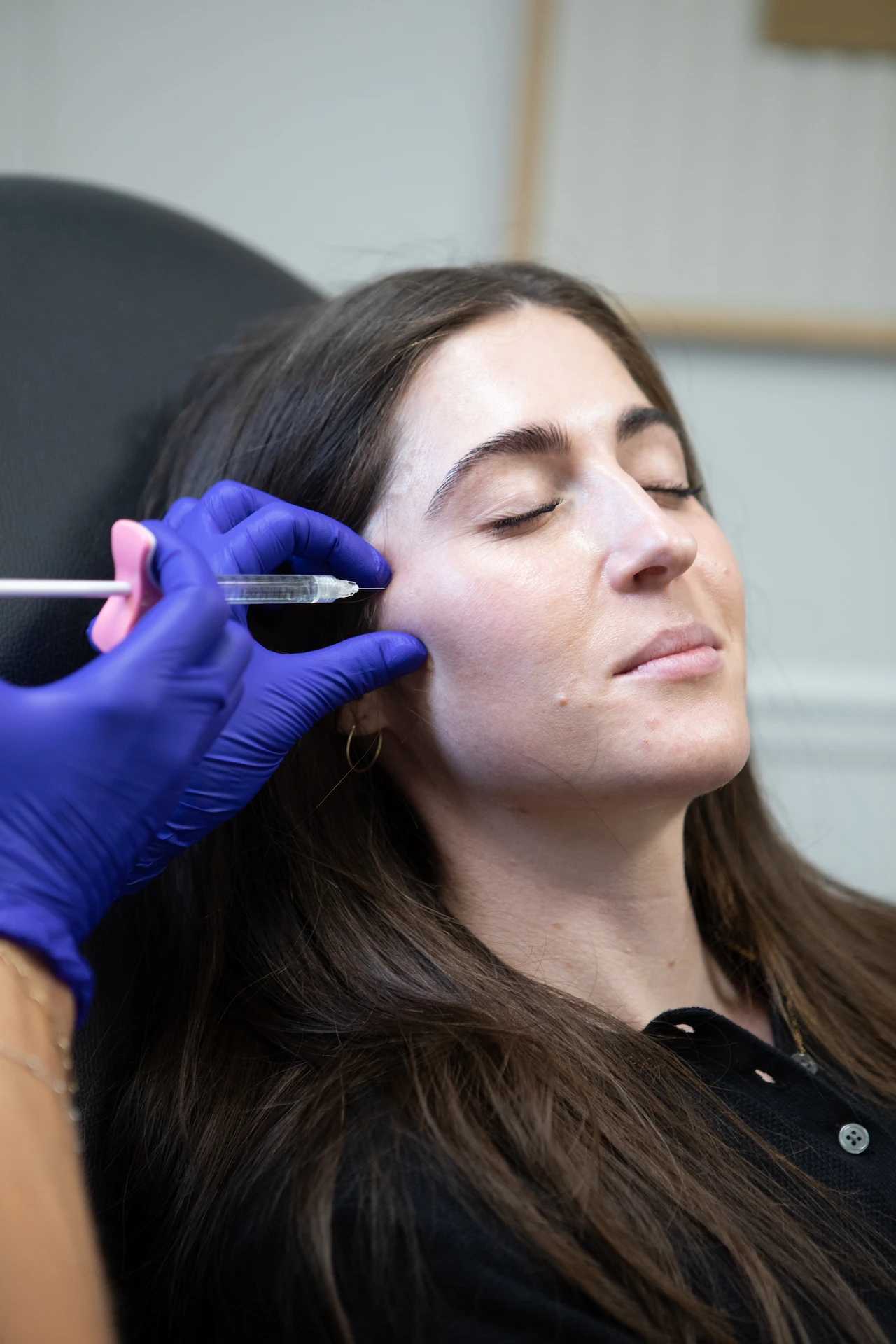 woman's cheek being injected